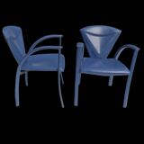Armchairs covered in vintage blue leather