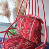 Restored vintage 70s armchair with custom-made Moroccan cushions, pink and red armchair
