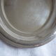 Oval plate in silver metal