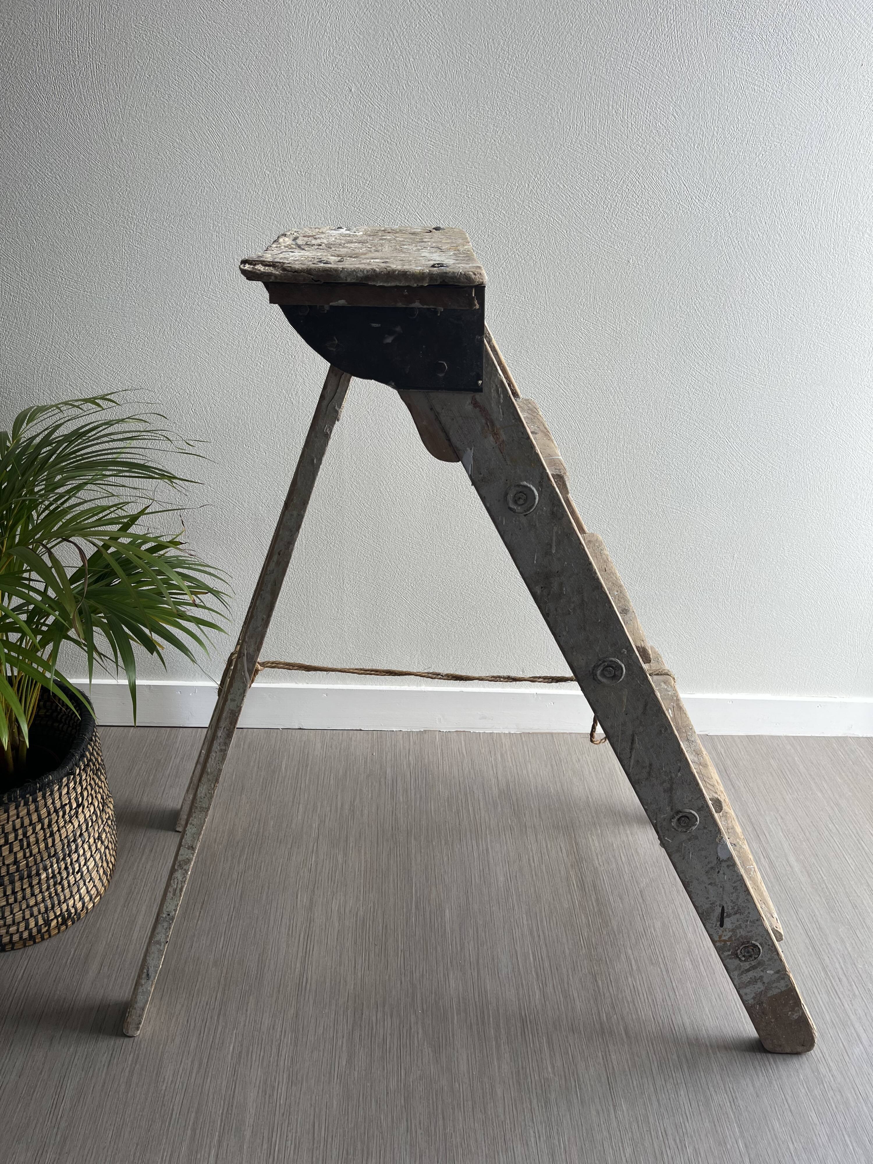 Former stepladder of patinated wood painter