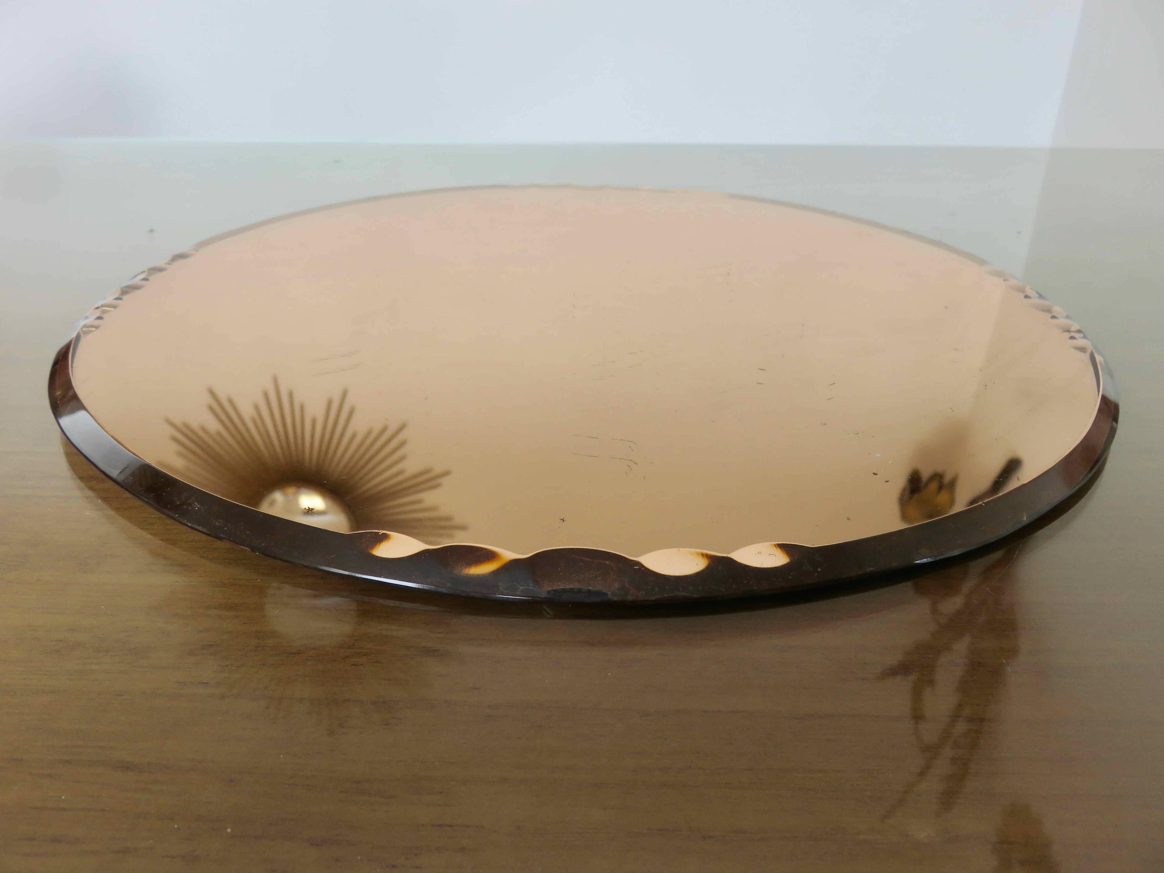Round beveled amber pink mirror