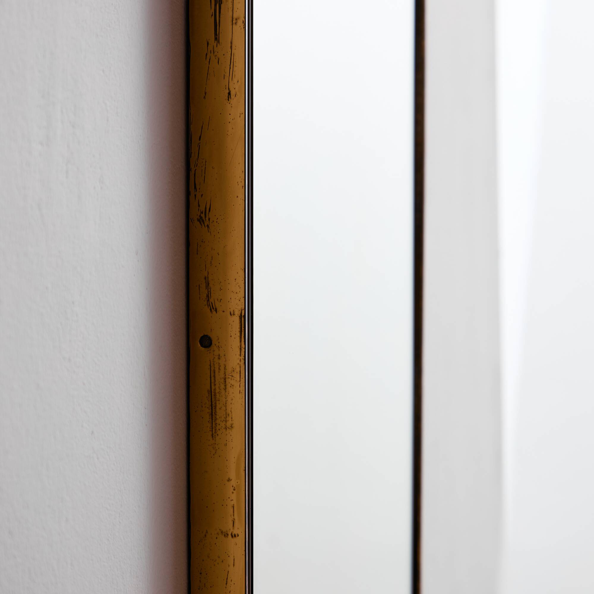 Metal and brass framed mirror