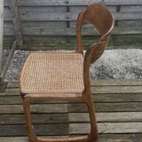 4 magnificent Baumann sled chairs, with caning.
