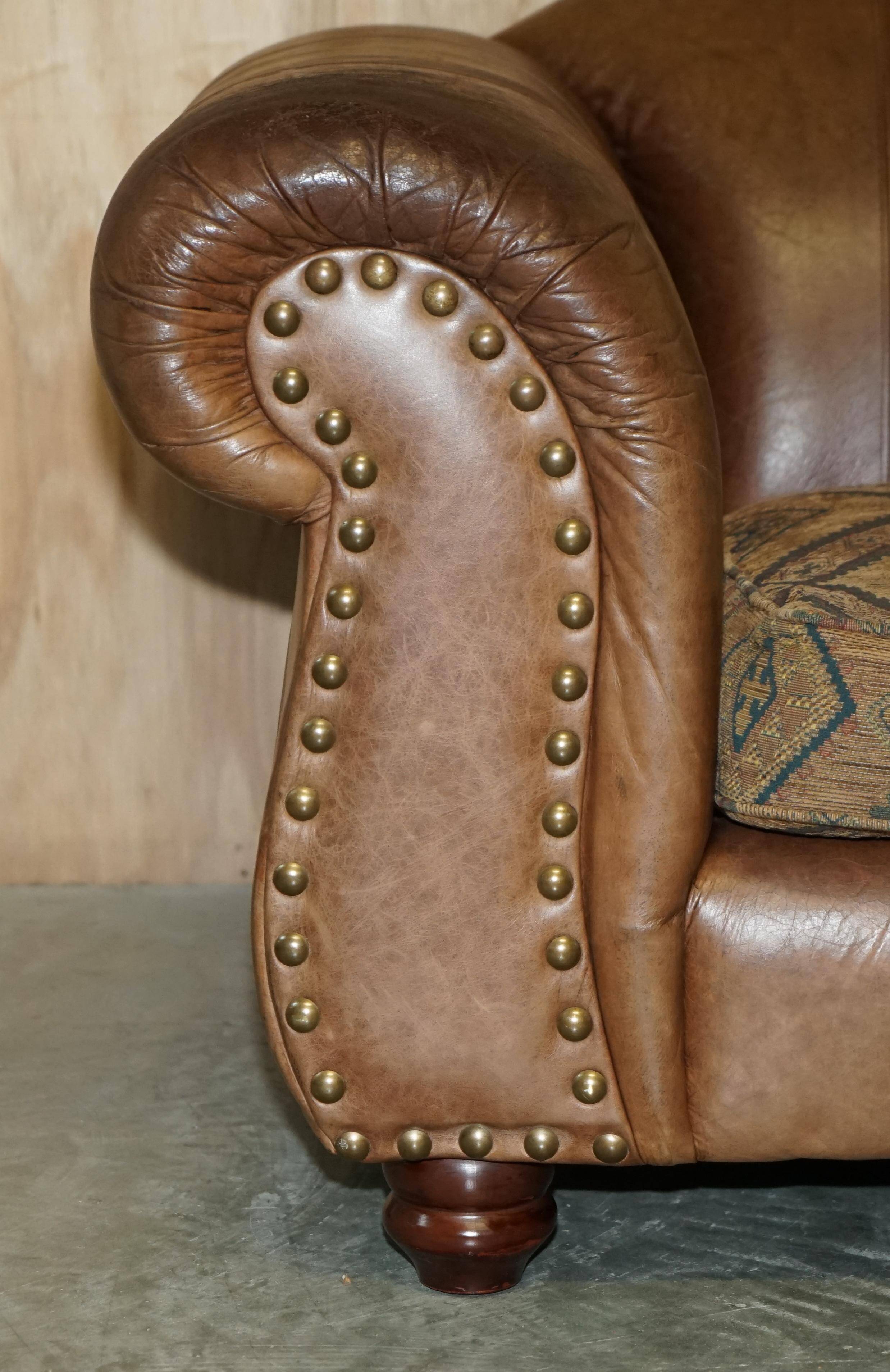 Vintage leather sofas by Thomas Lloyd with Kilim cushions.