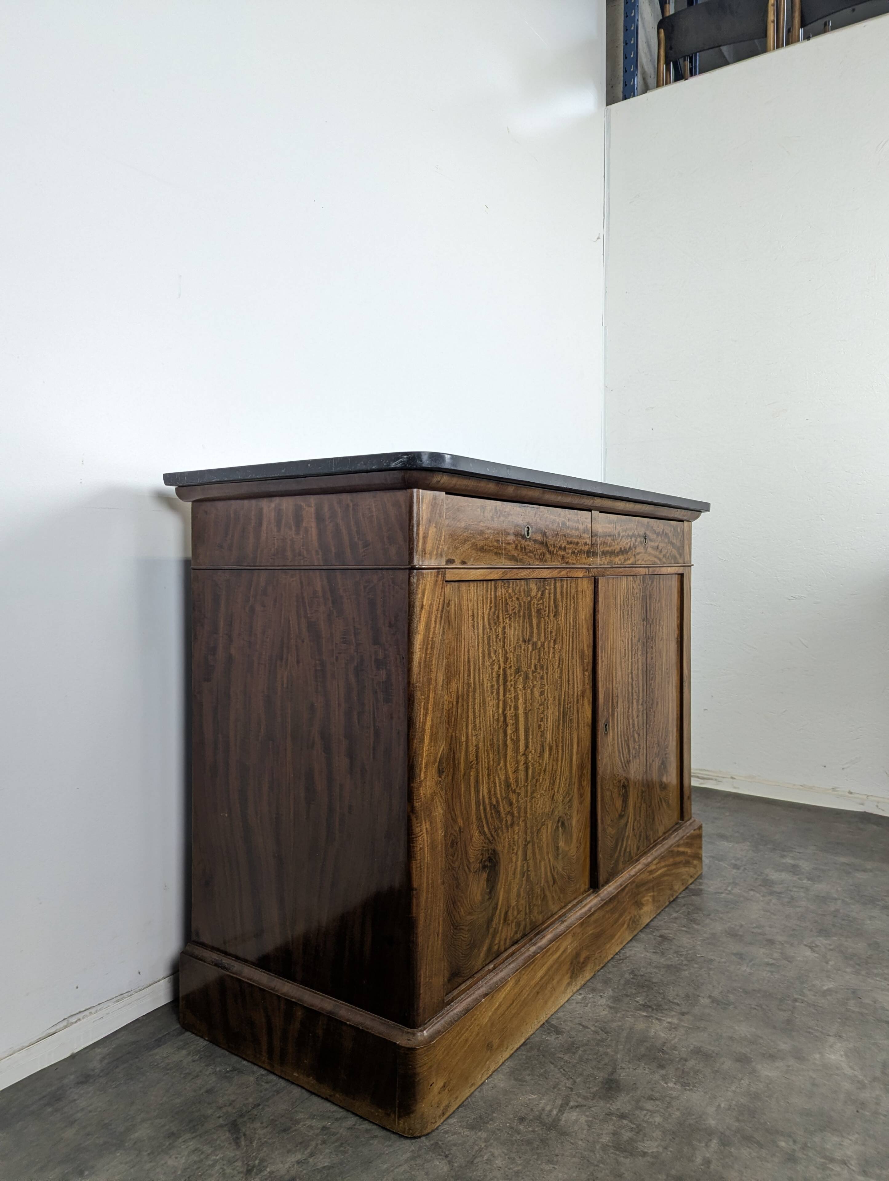 Louis Philippe two-door buffet in flame mahogany.