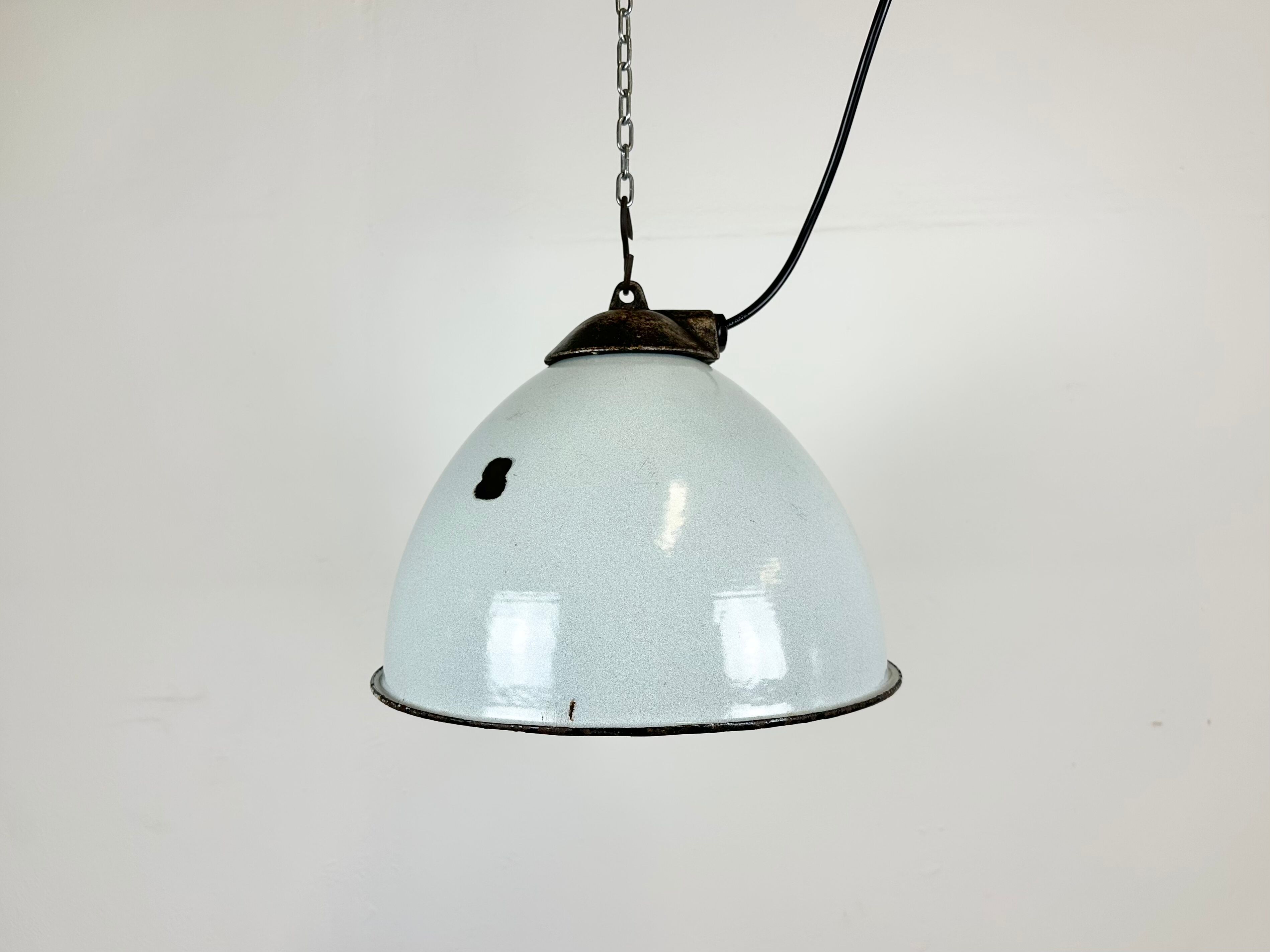 Industrial grey enamel factory lamp with cast iron top, 1960s