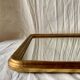 Grand miroir mural style arche en bois peint doré