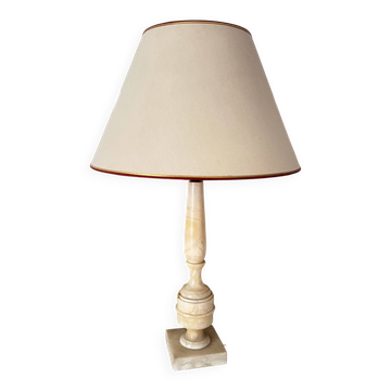 Antique lamp with a marble base.