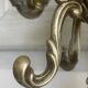 Freestanding brass coat rack