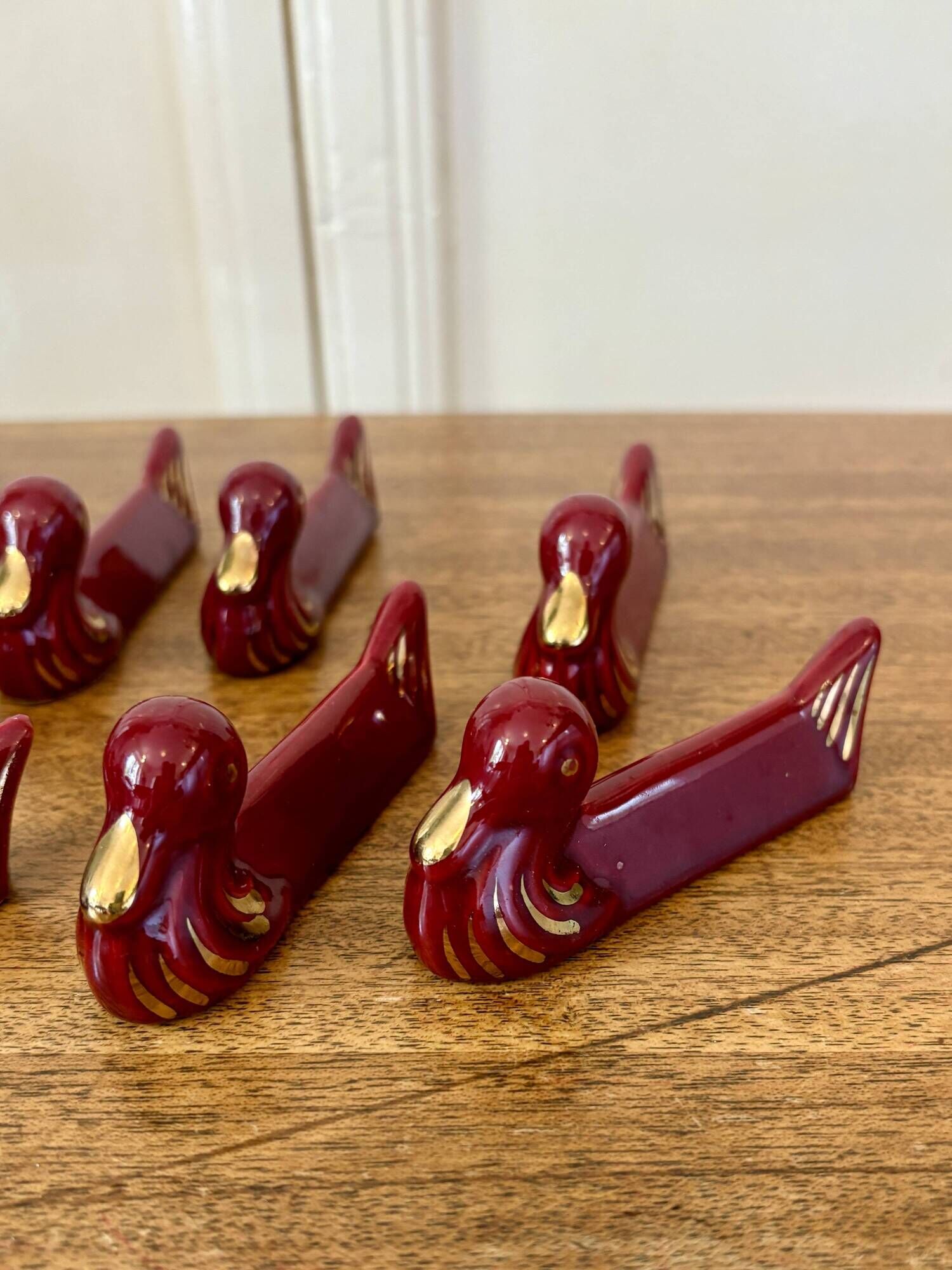 Set of 8 vintage slip knife holders in the shape of red ducks and