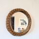 Round mirror in 60s design woven rattan