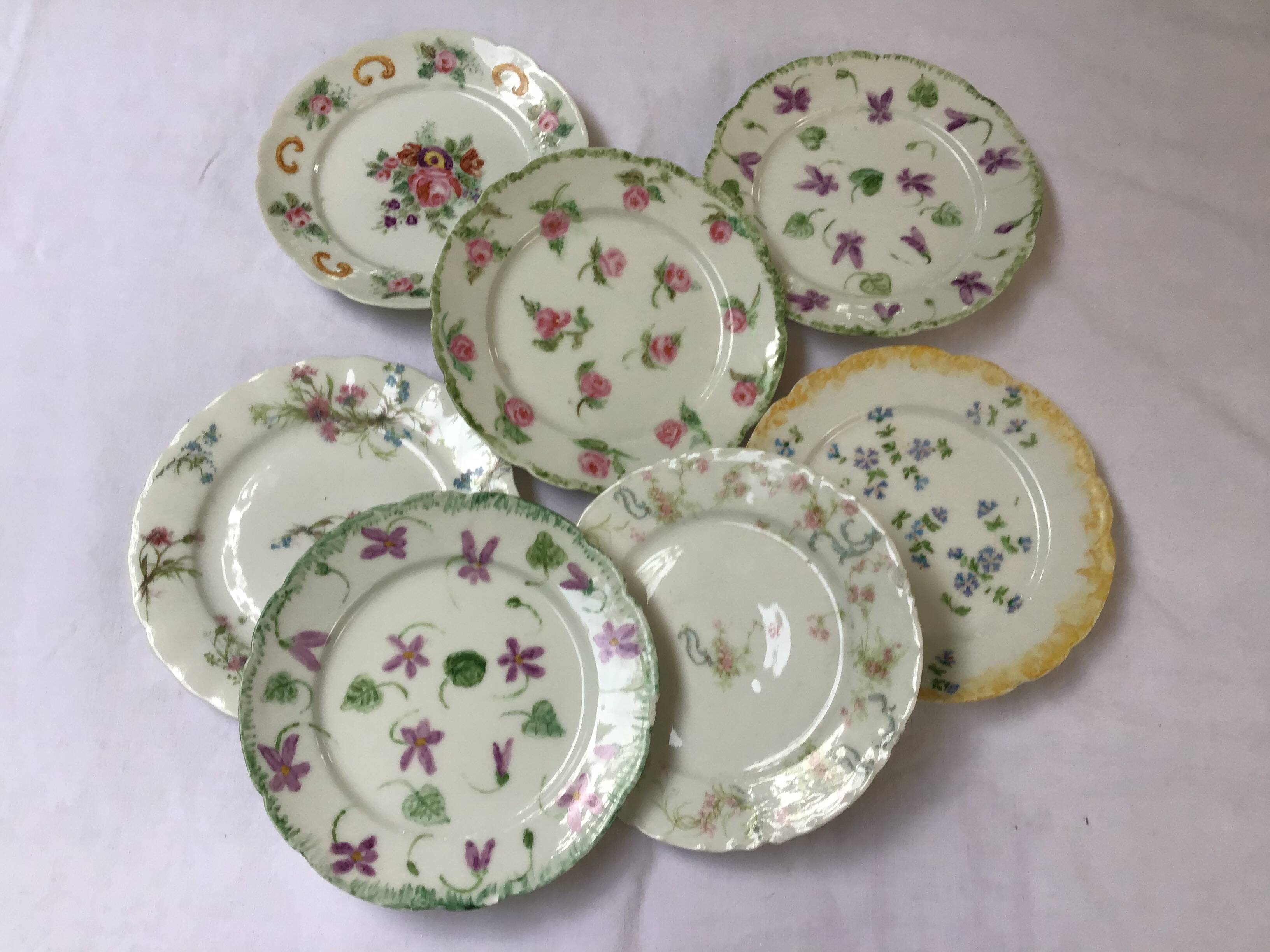 7 small plates in fine Limoges porcelain