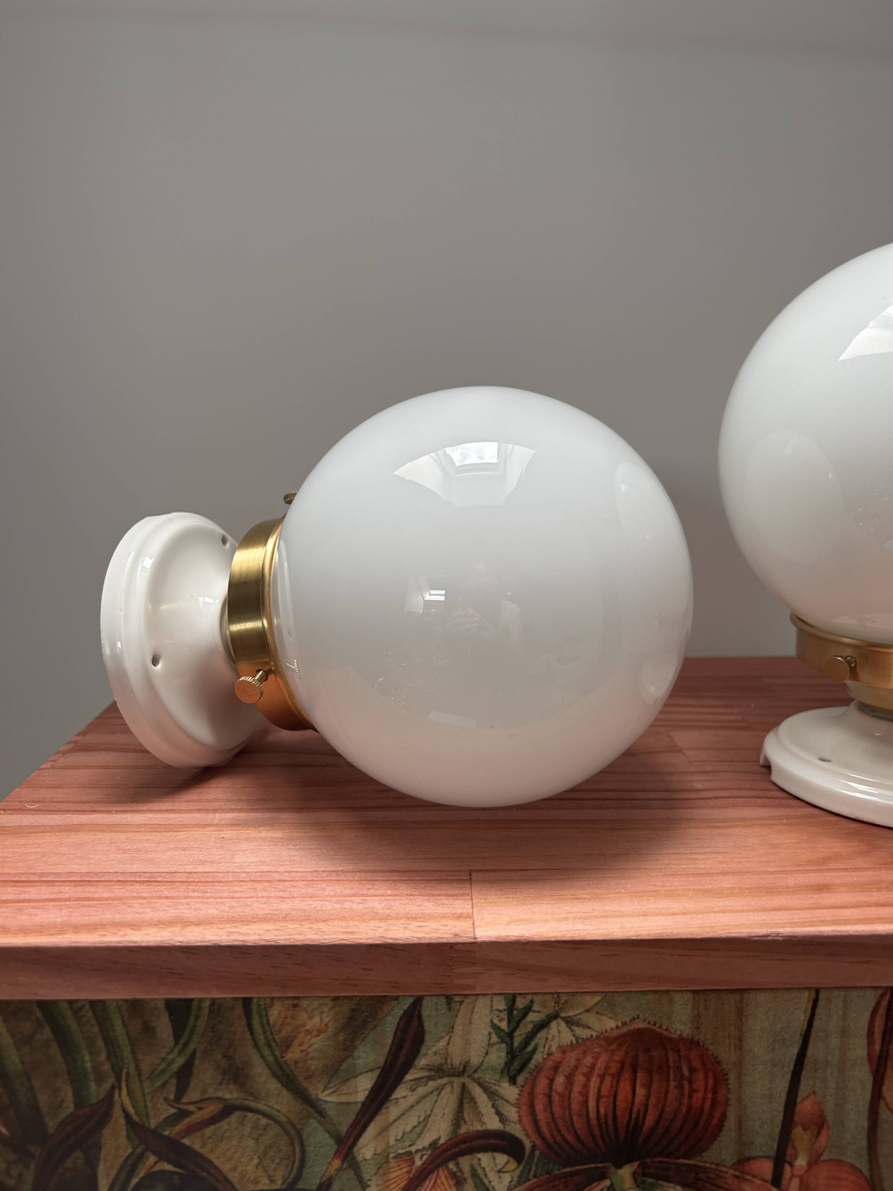 Set of two white opaline ball wall lights
