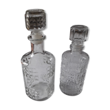 Set of 2 chiseled glass liquor decanters