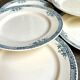 6 assiettes plates Longchamp en terre de fer, service "Lily"