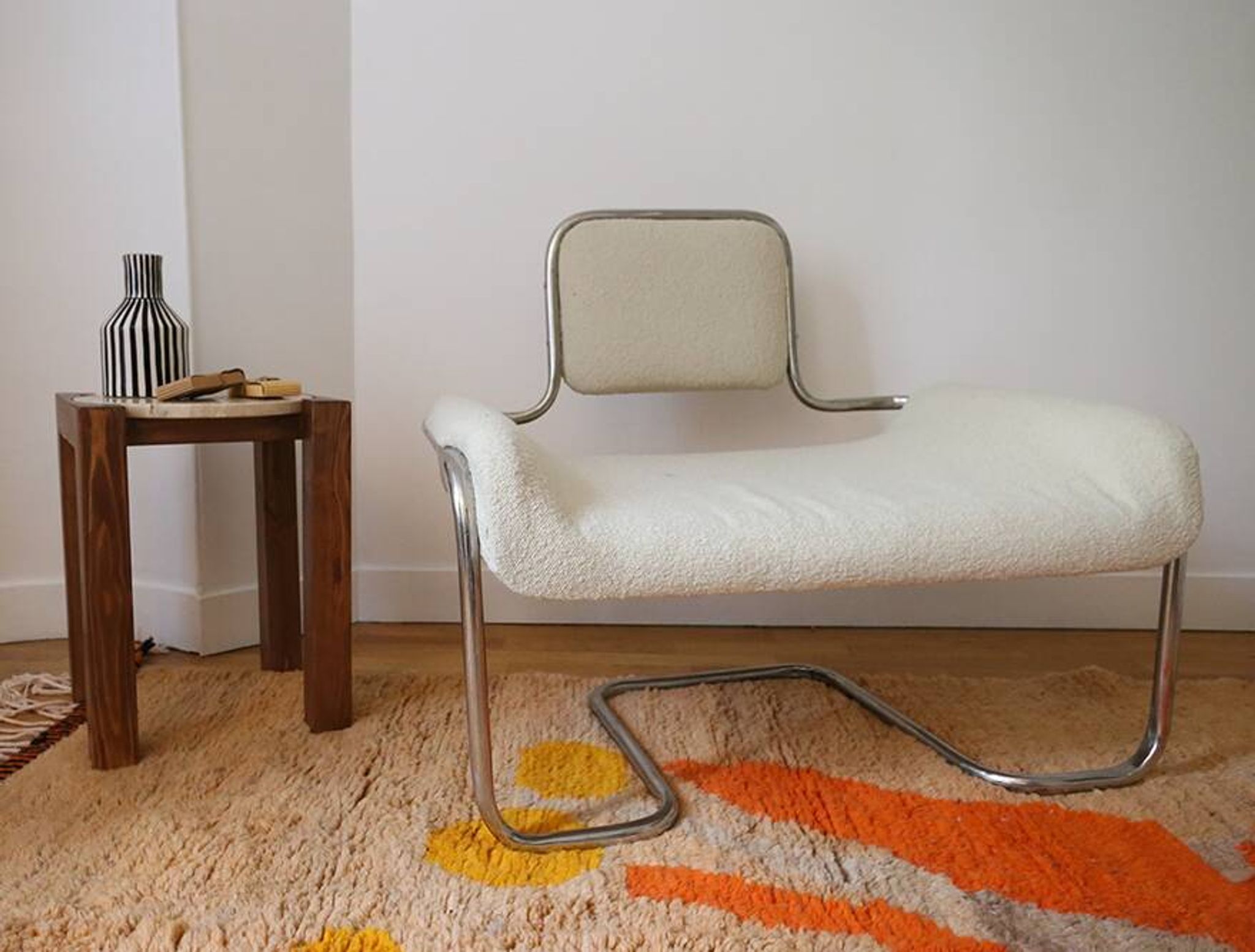 Armchair in ecru wool and stainless steel
