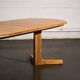 Oval dining table with 2 extensions.