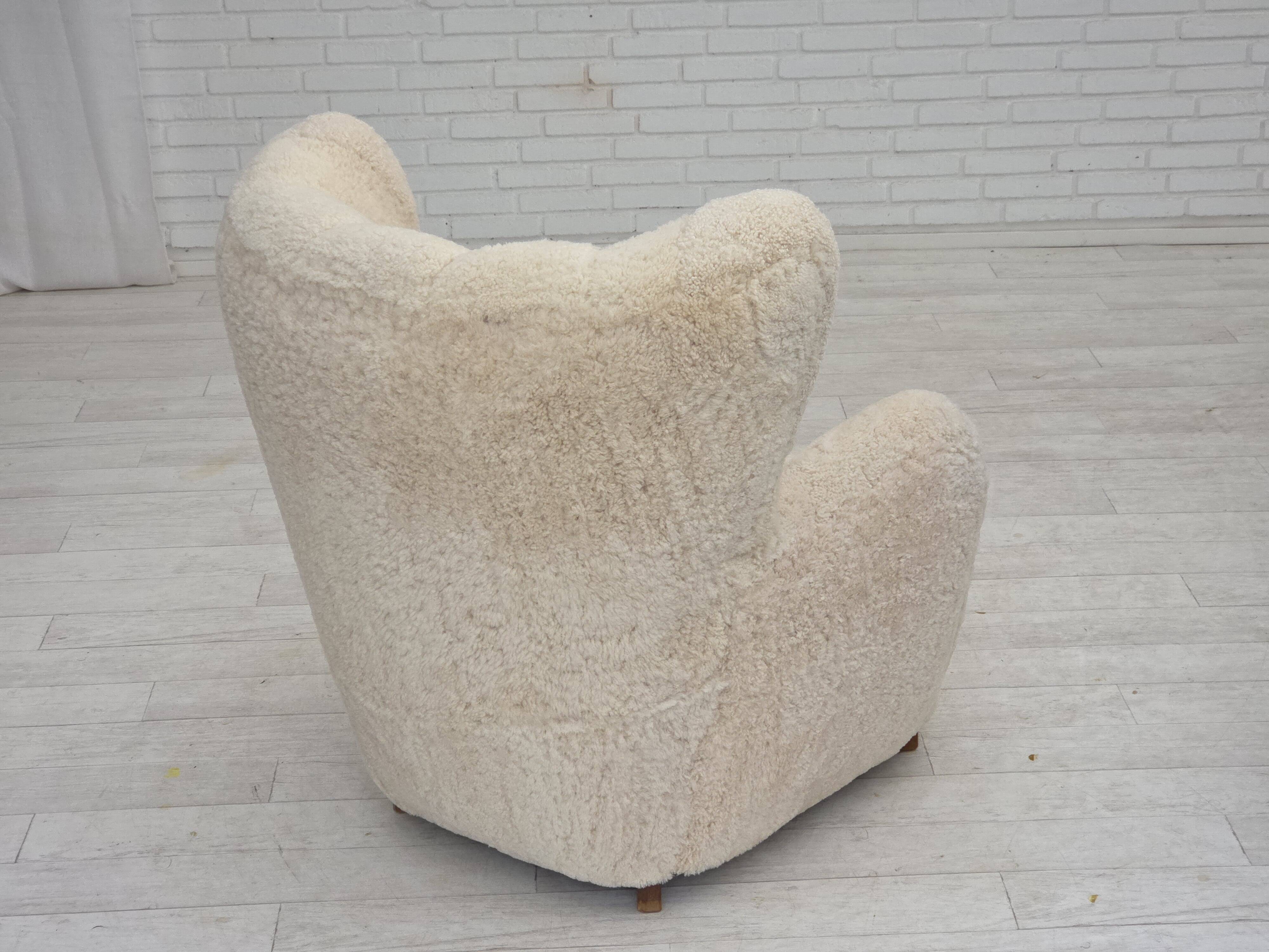 1960s, Danish design, reupholstered highback armchair, genuine sheepskin.