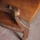 Barber chair in wood and leather with adjustable headrest, office chair.