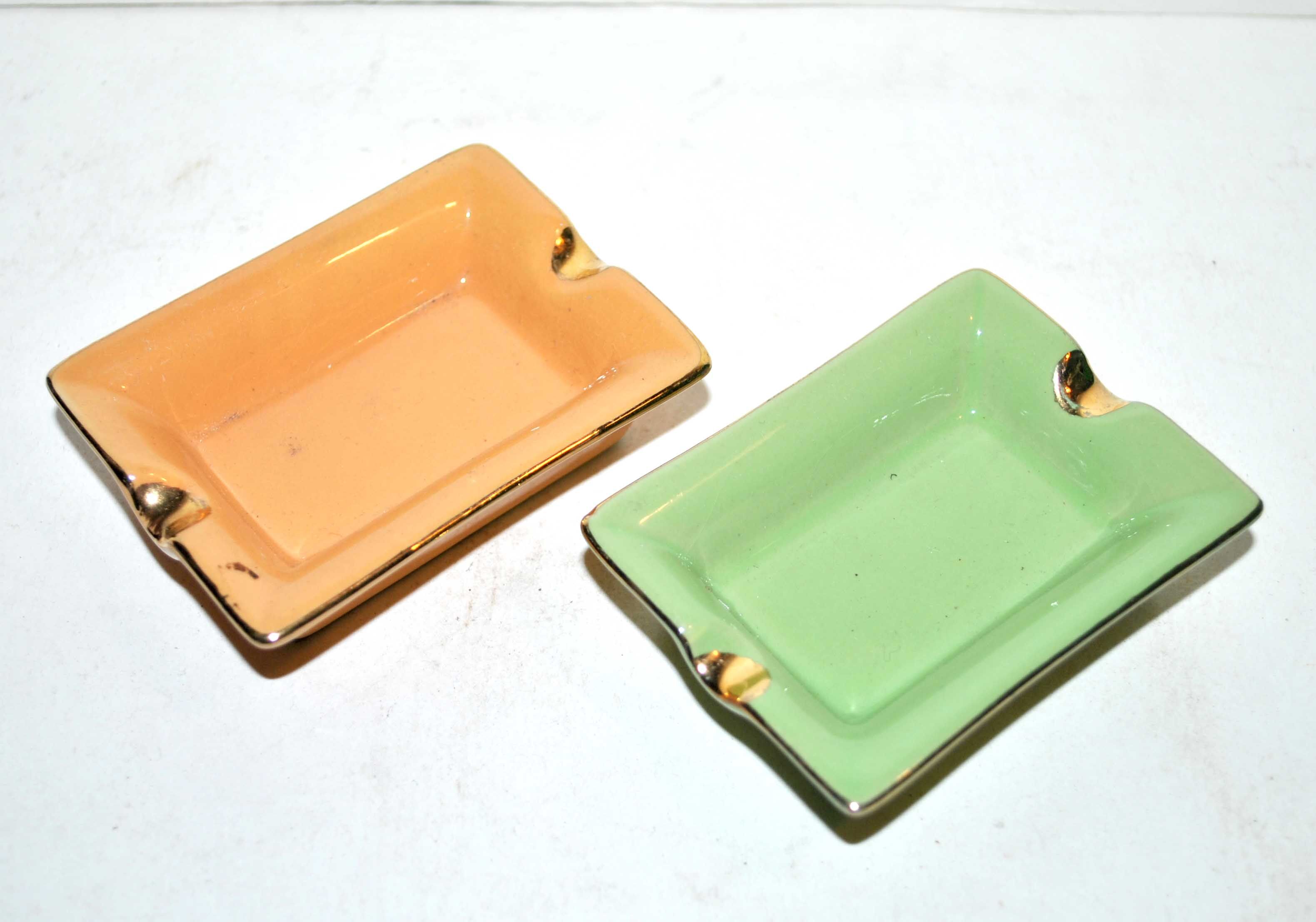 Pair of vintage ashtrays in glazed ceramic and golden orange and green