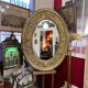 A. Arens, Antwerp, important oval mirror in repoussé brass with numerous animal decorations