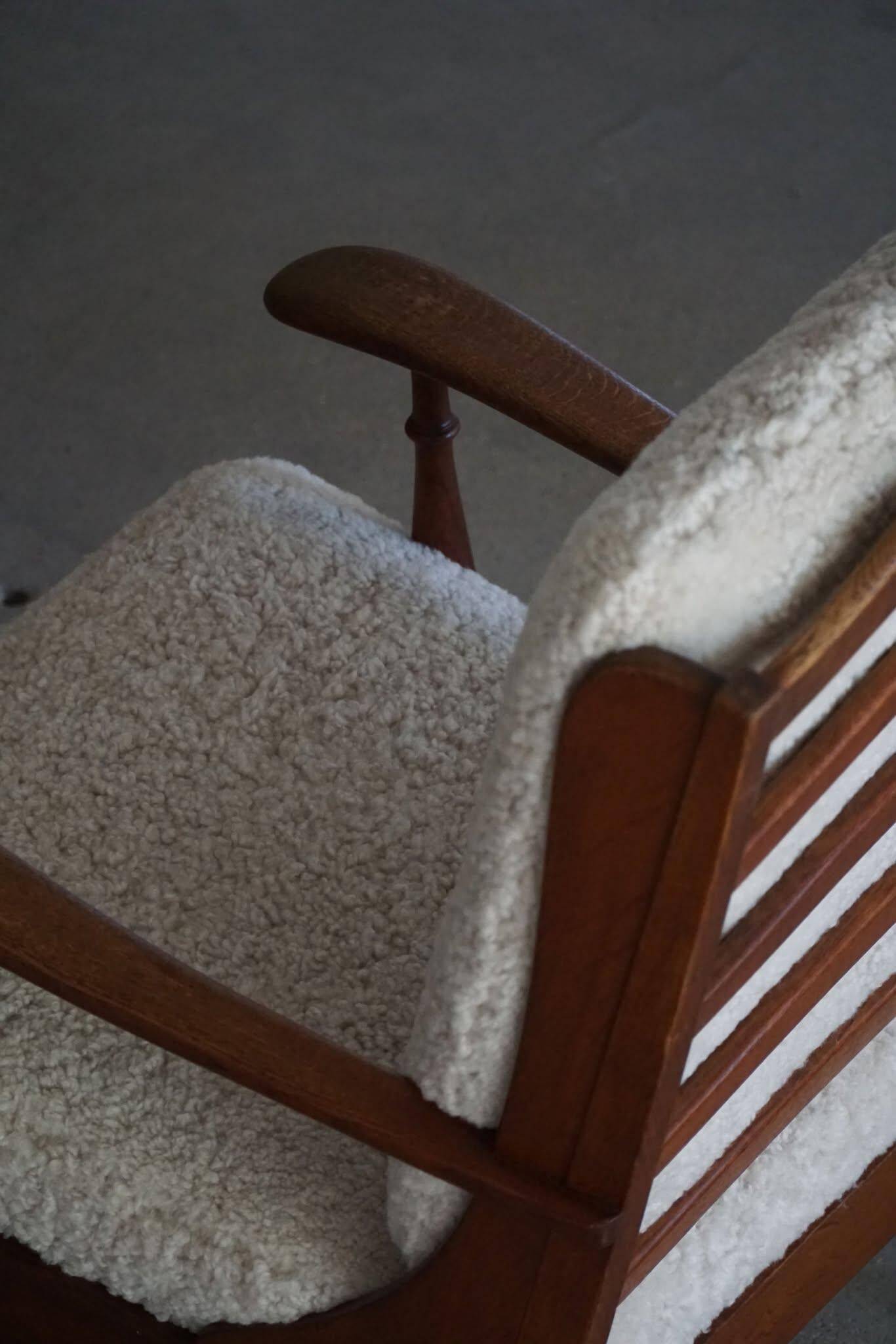 Modern Danish design, a pair of high-backed armchairs in oak and lambswool, 1950s.