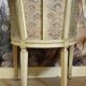Gondola armchair in Louis XVI style, carved wood with a cream patina.