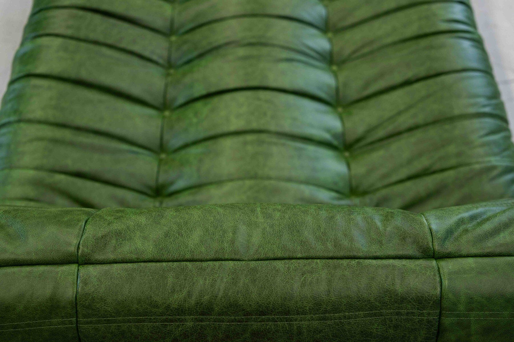Togo chaise lounge in green leather attributed to Michel Ducaroy for Ligne Roset, 1974