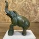 Pair of art deco bookends with elephant decoration in regulated and travertine, vintage