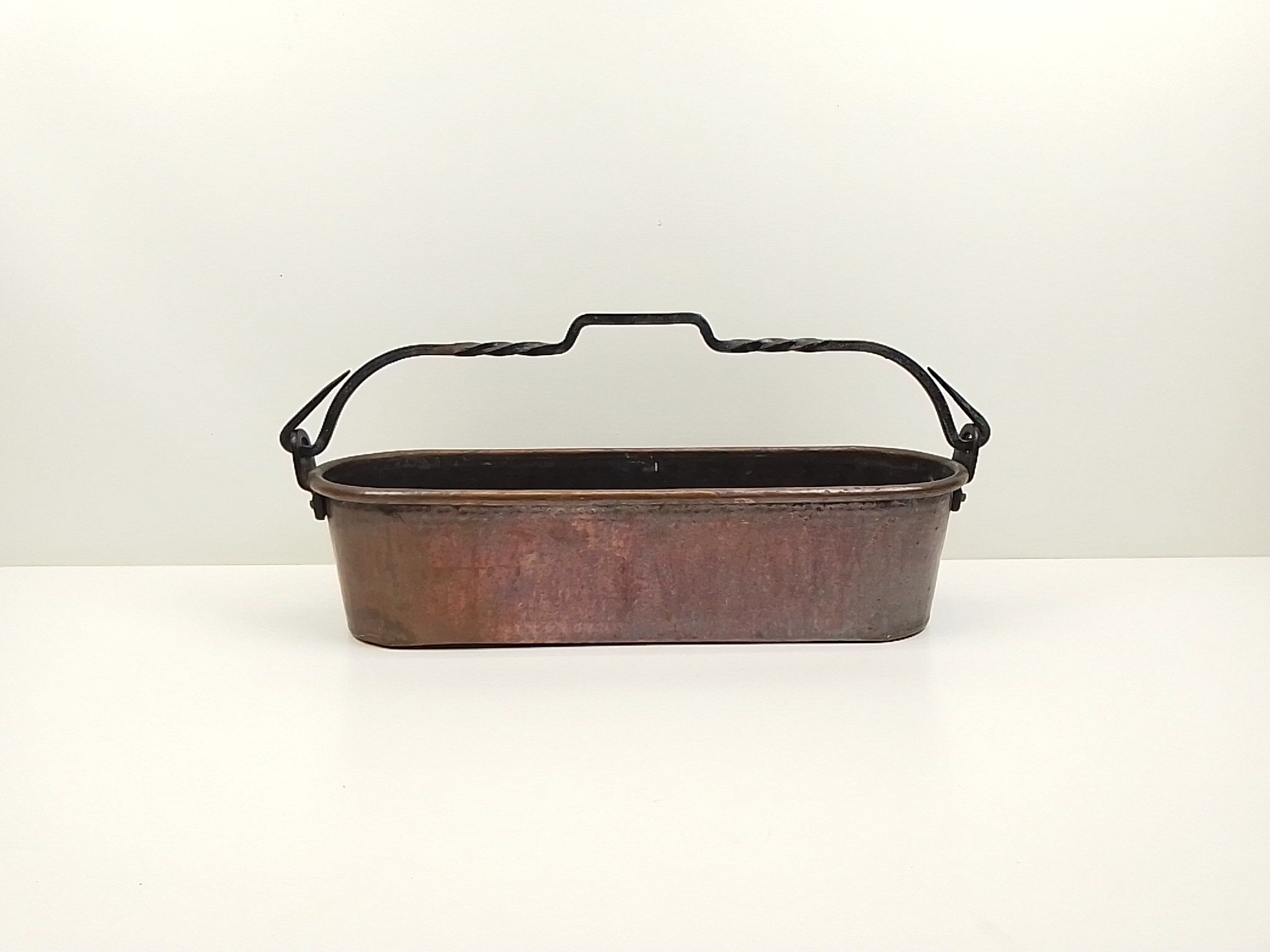 Copper planter and wrought iron handle