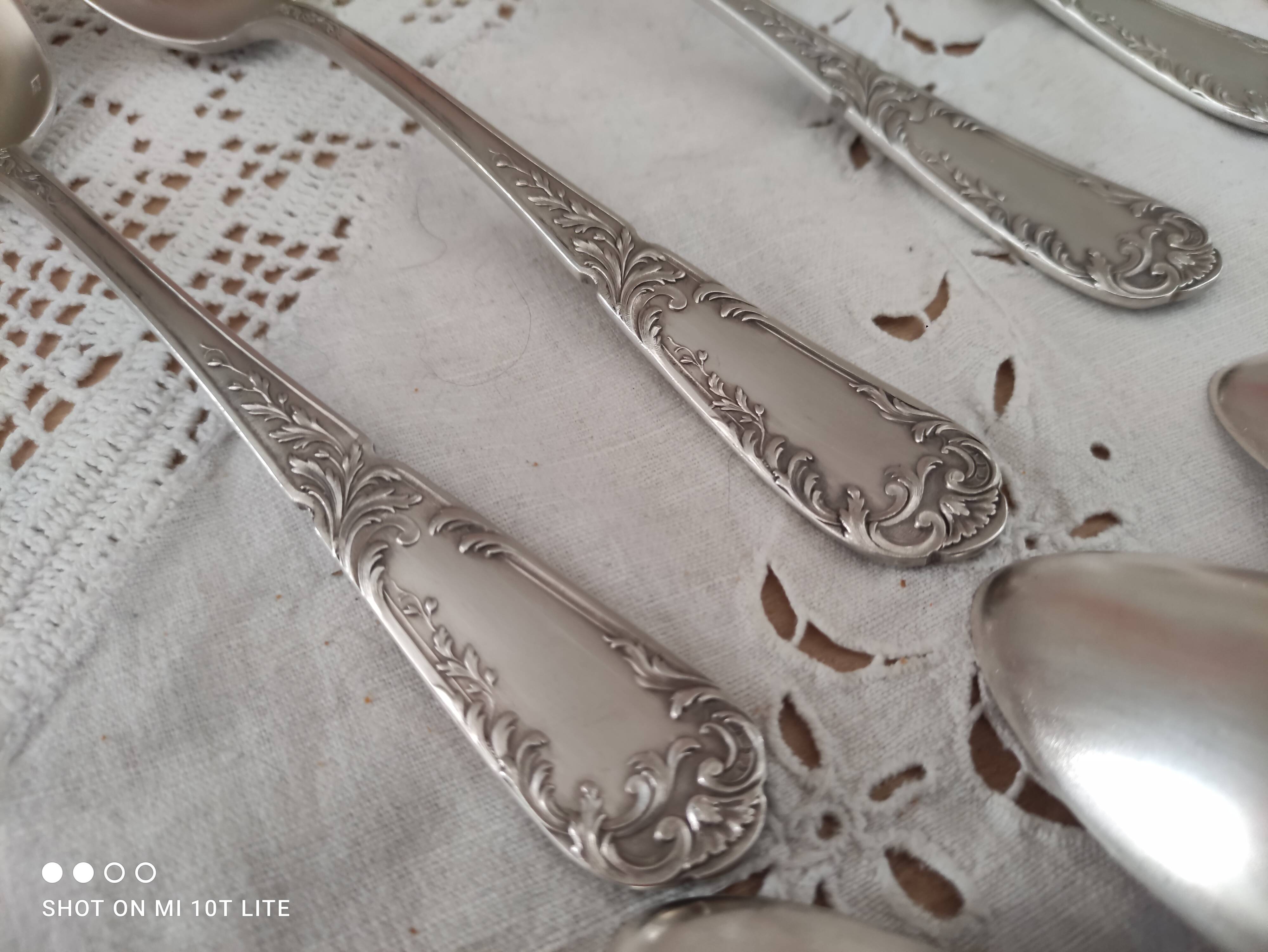 Set of 12 old silver-plated soup spoons