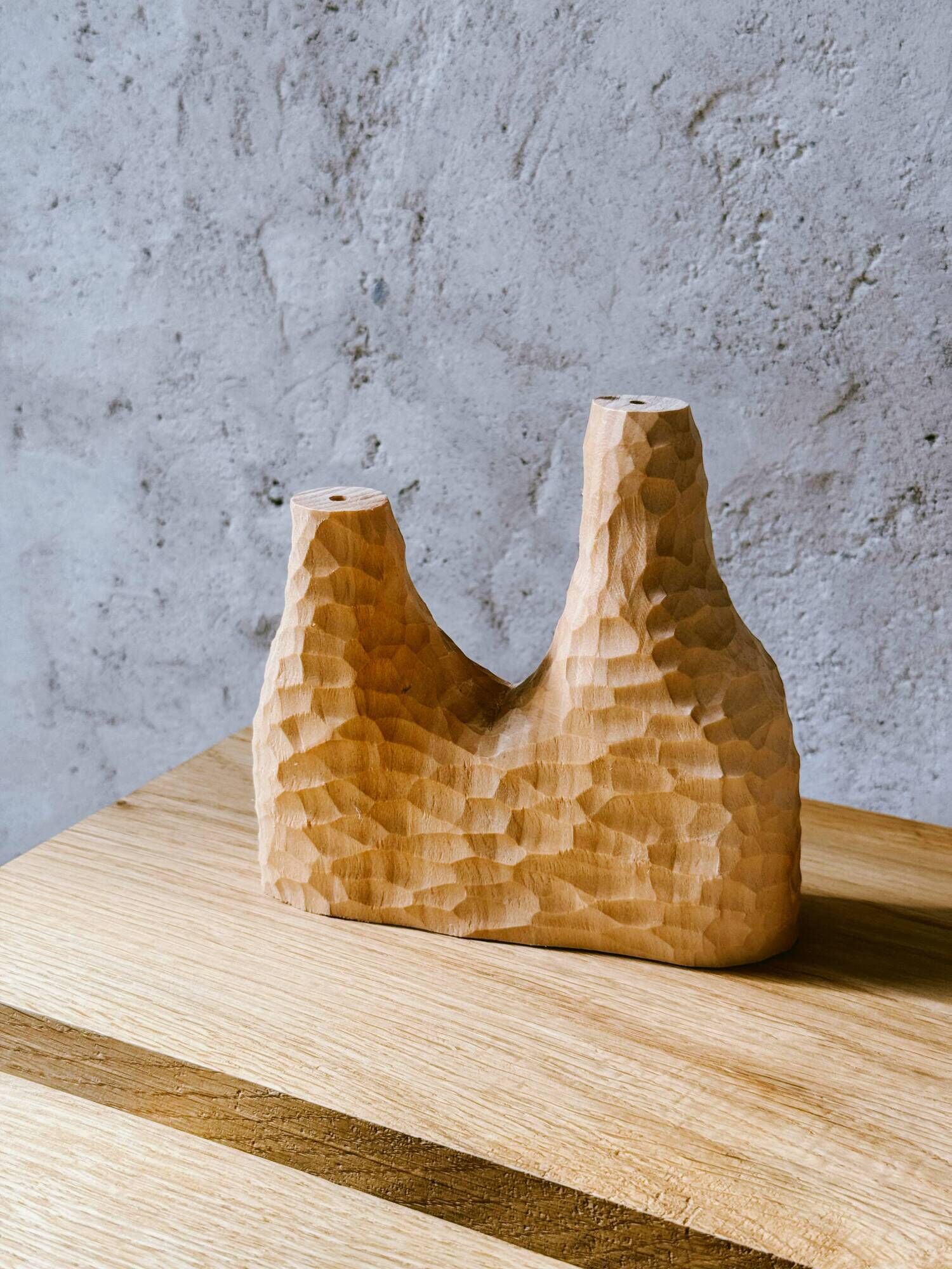 Hand-carved soliflore vase in solid lime wood.