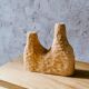 Hand-carved soliflore vase in solid lime wood.