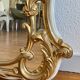 Large gold mirror in Louis XV style