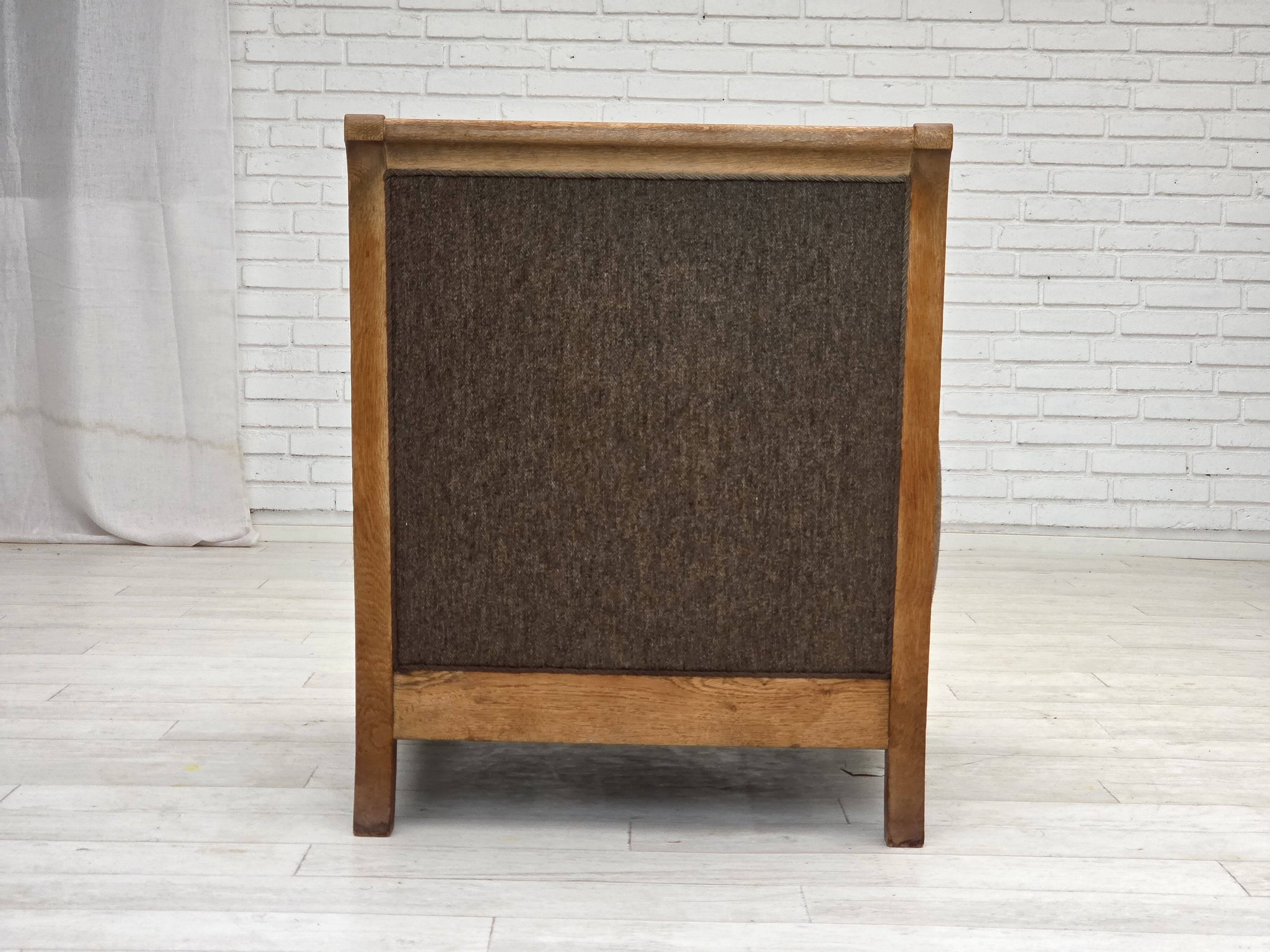 1950s, Danish armchair, furniture wool, solid carved oak wood.
