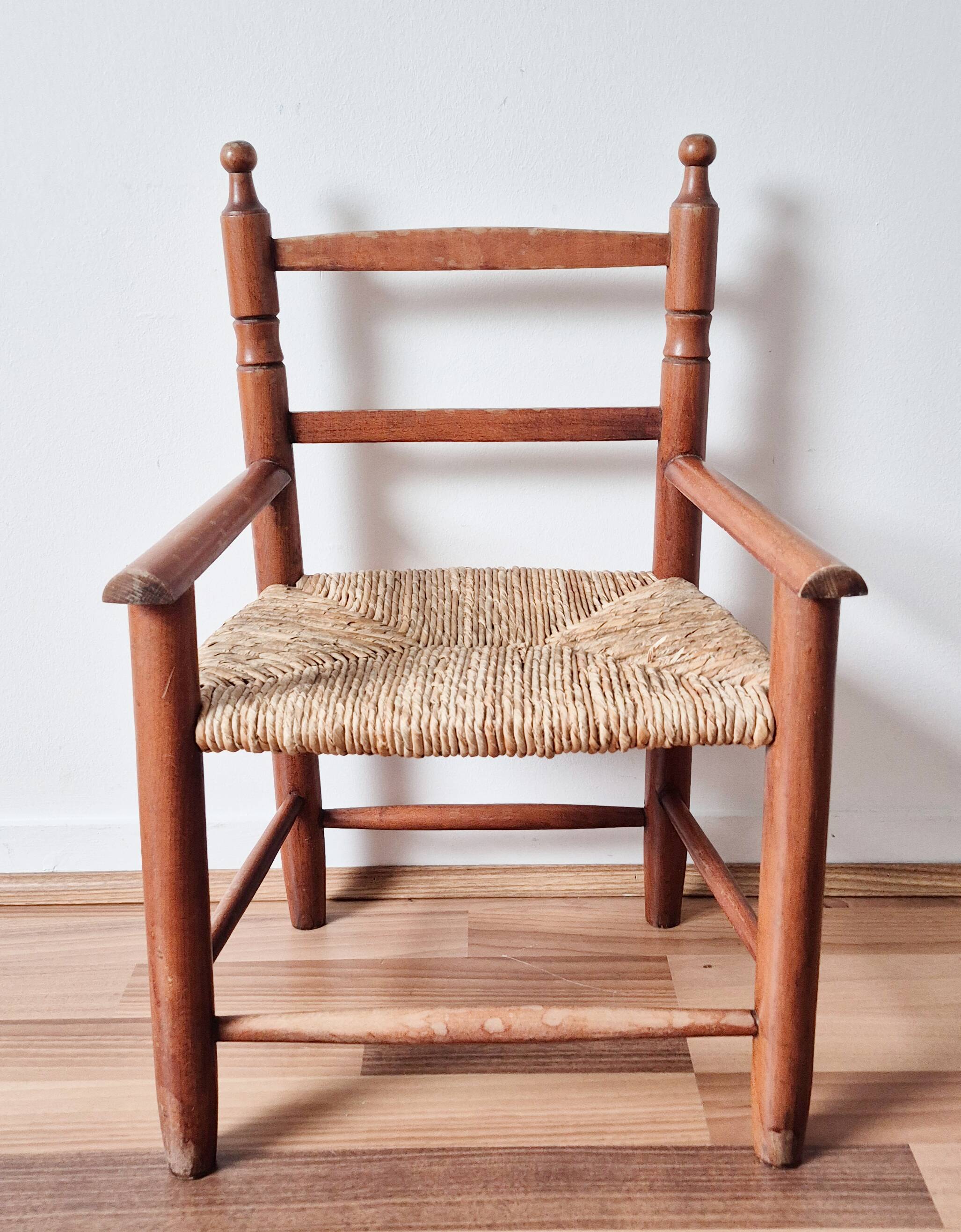Vintage wooden and straw children's armchair
