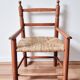 Vintage wooden and straw children's armchair