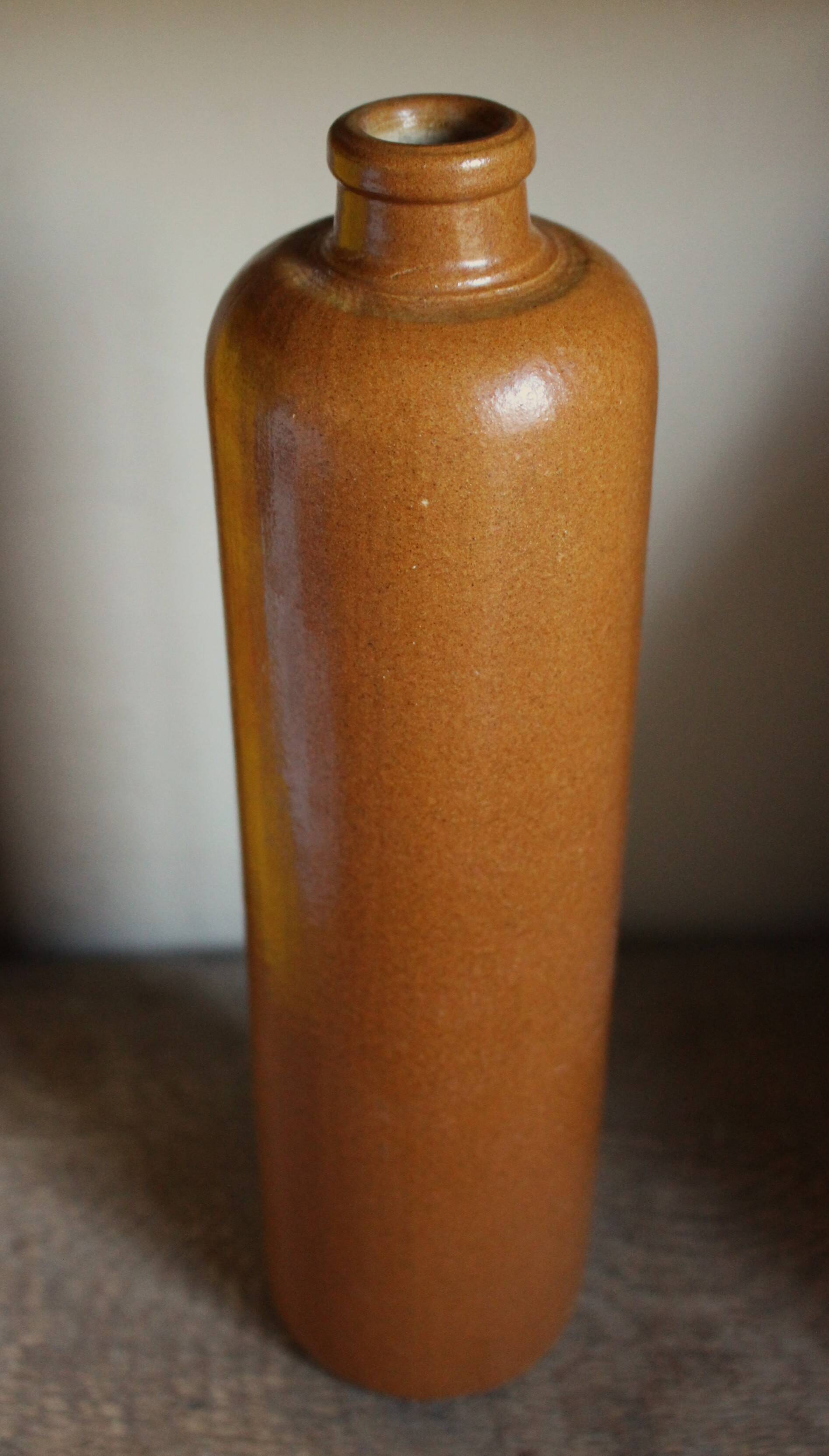 Vintage stoneware liqueur bottle