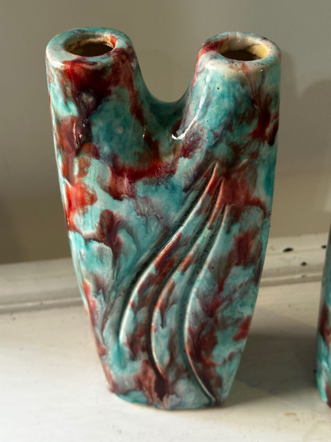 Vintage pair of turquoise and red ceramic candlesticks