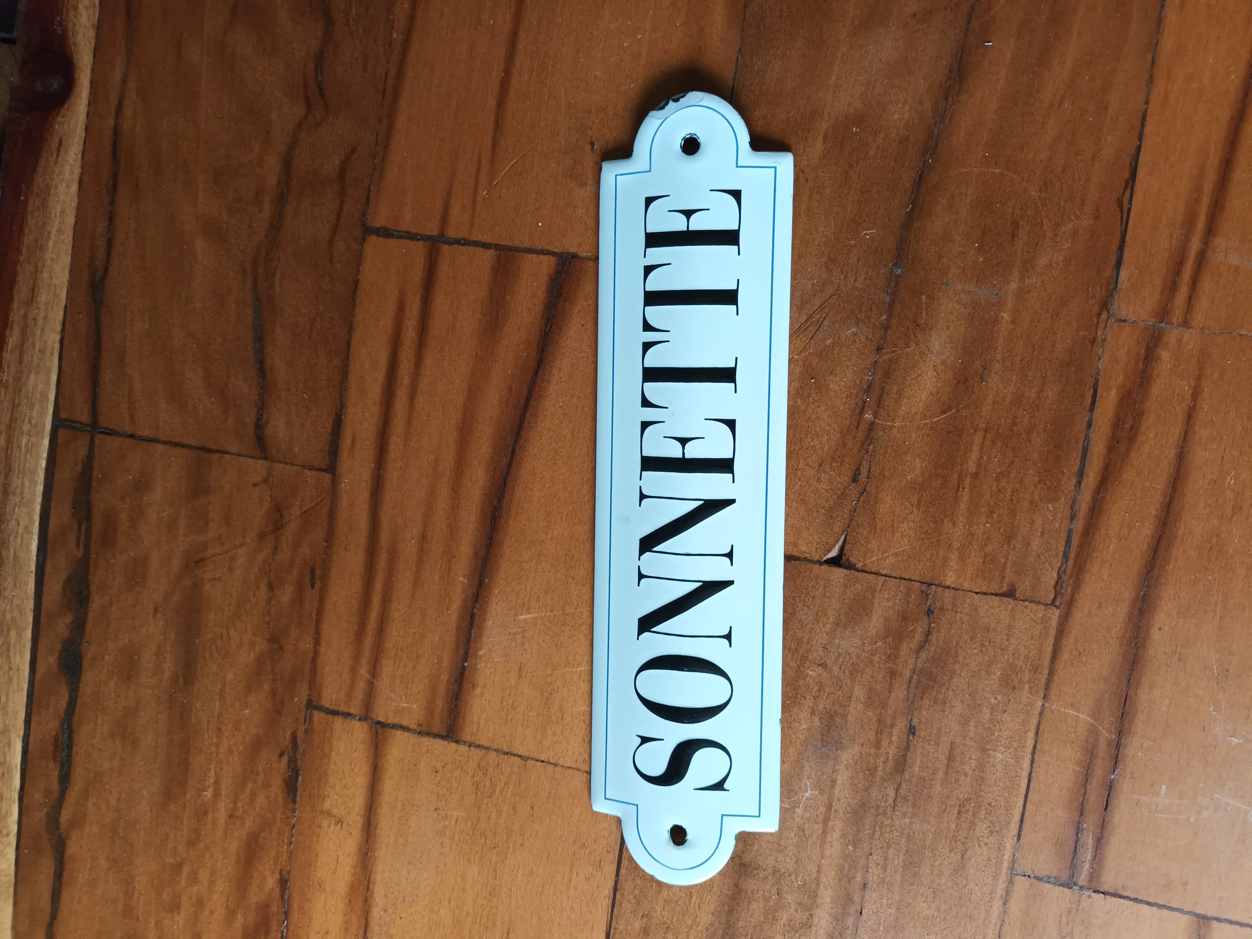 Doorbell enamel plate