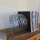 Chrome spring magazine rack, 1970