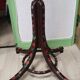 Wooden parrot coat rack with painted floral decoration.