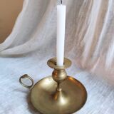 Large hand candlestick in gilded brass