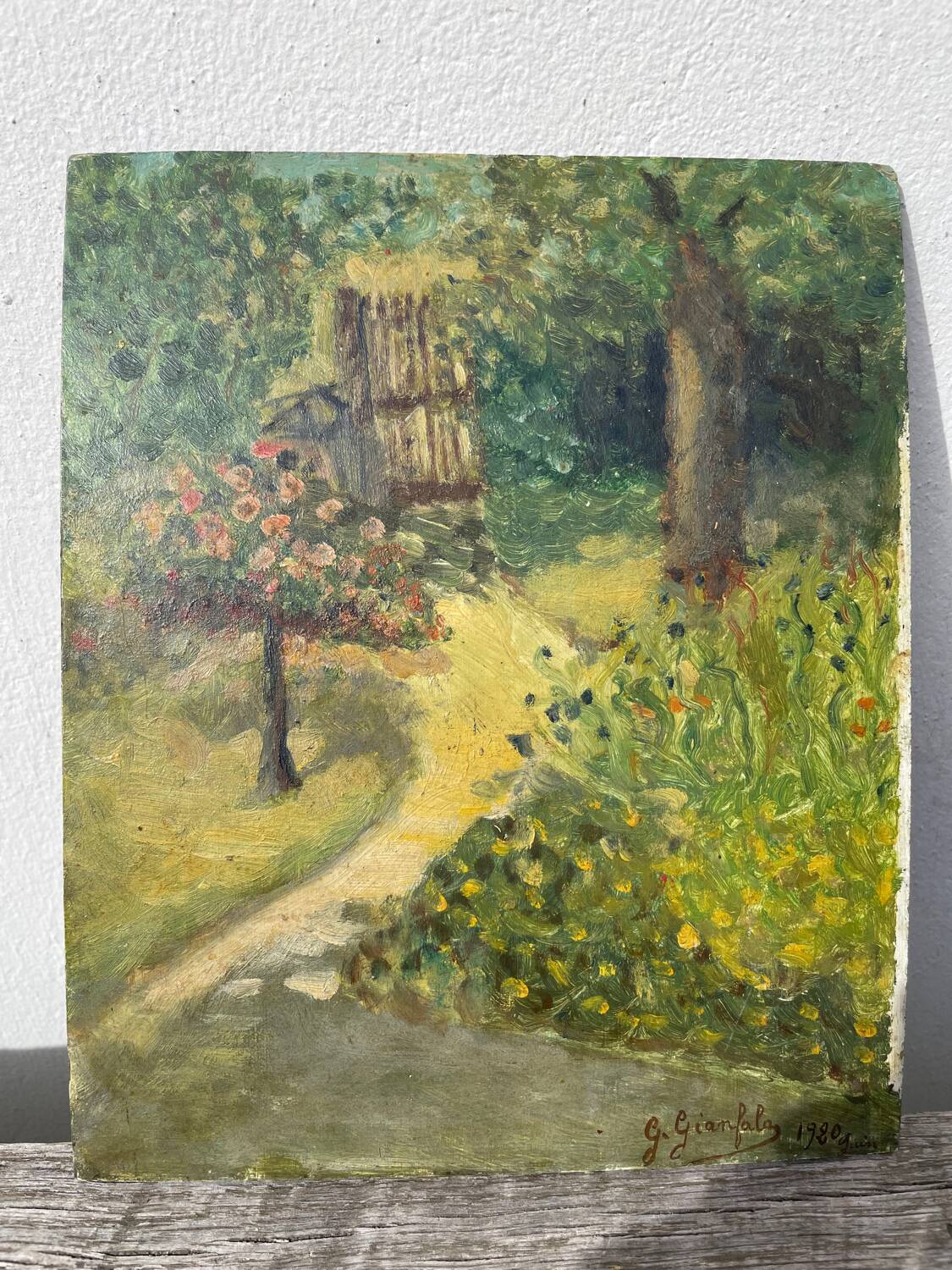 Paysage jardin à l’huile signé