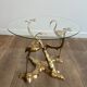 Coffee table model with cranes surrounding a brass bonsai and round glass top by Willy Daro.