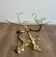Coffee table model with cranes surrounding a brass bonsai and round glass top by Willy Daro.