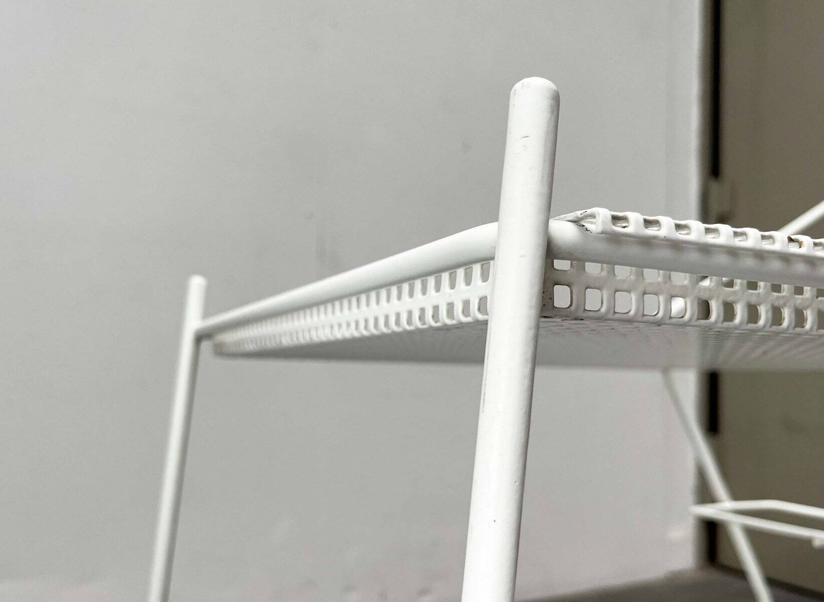 Mid-century modern minimalist perforated metal bar cart from the 1960s.