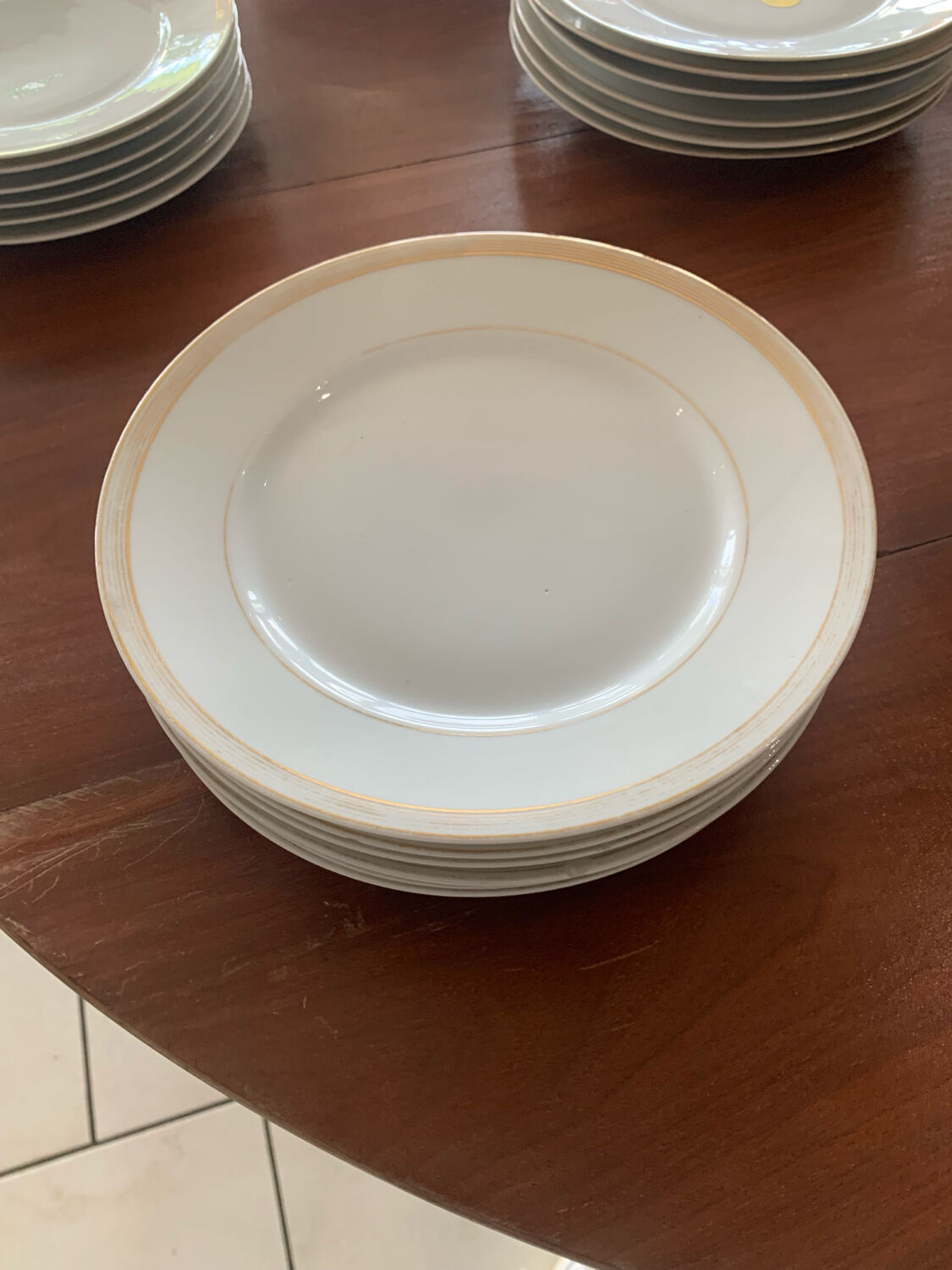 Lot of six flat plates, crockery, old white, gilded