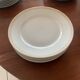 Lot of six flat plates, crockery, old white, gilded
