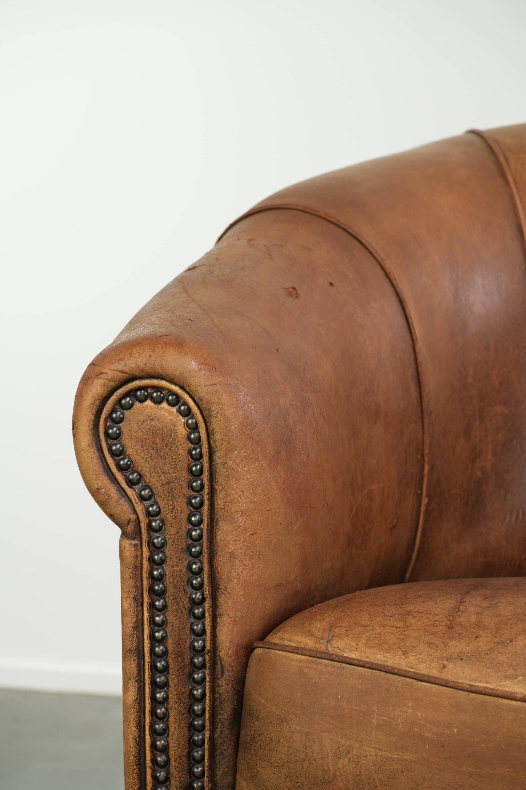 Vintage sheepskin clubchair in a beautiful cognac colour with a sturdy look